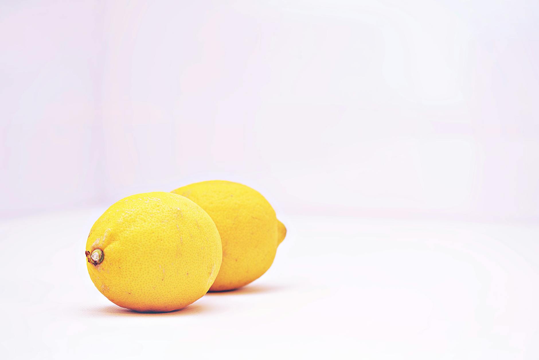 Colorful arrangement of vibrators on a bright yellow background, representing pleasure options across the cycle